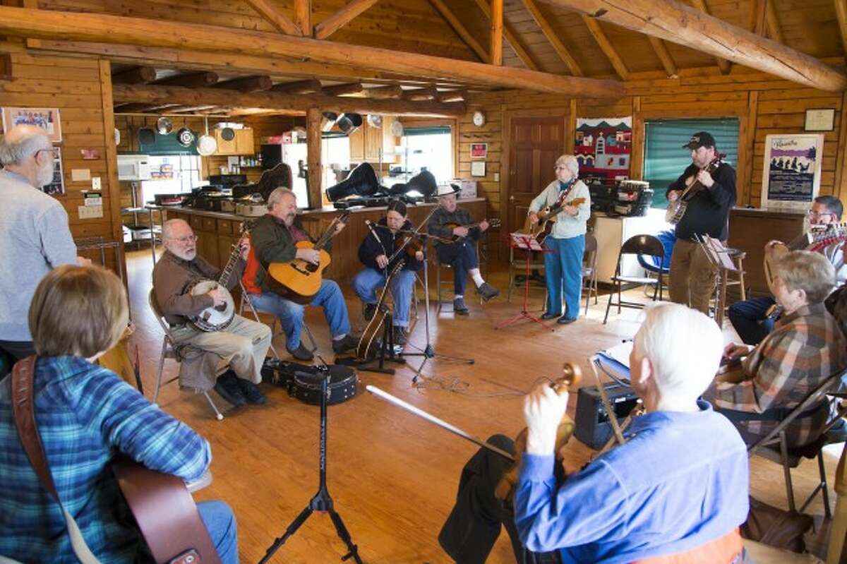 JAM ON: Local musicians and those from other areas of the state gather at the Wheatland Music Organization cabin on Saturday for an acoustic jamboree session. The jamboree event takes place every second weekend of each month, except September. (Pioneer photos/Karin Armbruster)