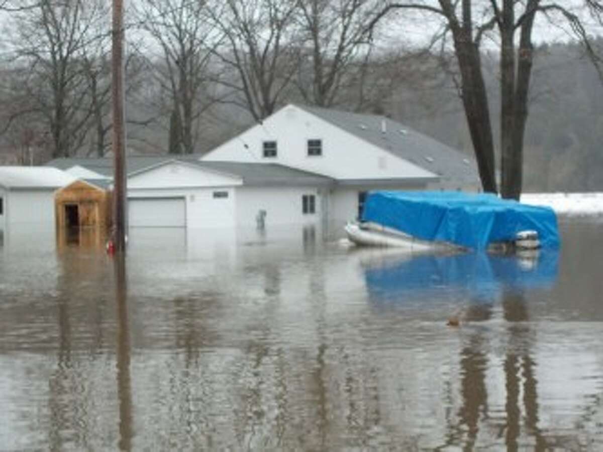 PROPERTY DAMAGE: This photo distributed by Mecosta County Emergency Management shows high water levels seen Jan. 30, 2013, on 183rd Avenue. Hovercrafts were able to measure 30 inches of water in some areas Jan. 31, 2013.