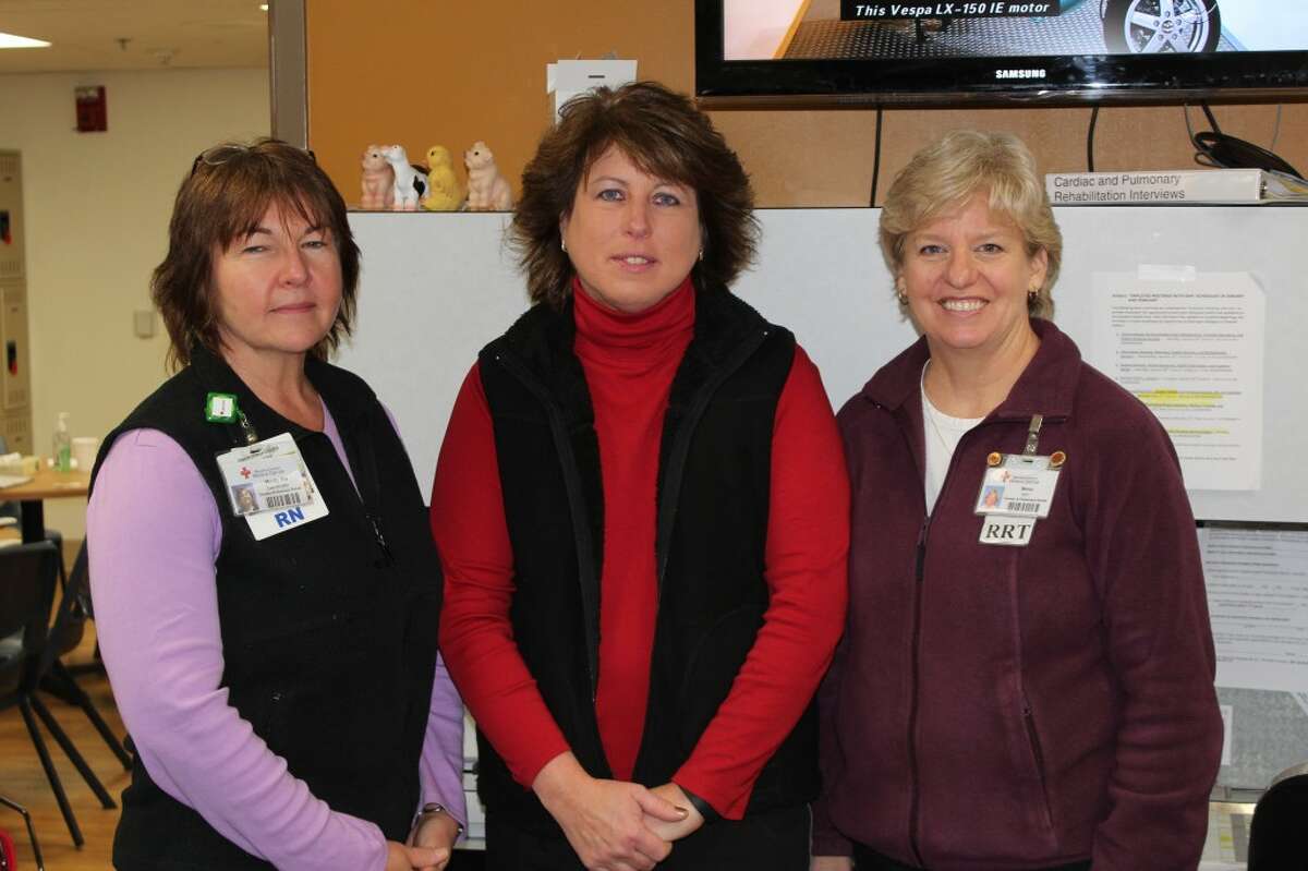 HELPFUL NURSES: (From left) Mindy Grunst, Tina Malcolm and Mona Stanski keep a watchful eye over patients as they exercise. Malcolm said her main goal is help the patients understand how to get their heart rate up to a safe level. (Pioneer photo/Lauren Gentile)