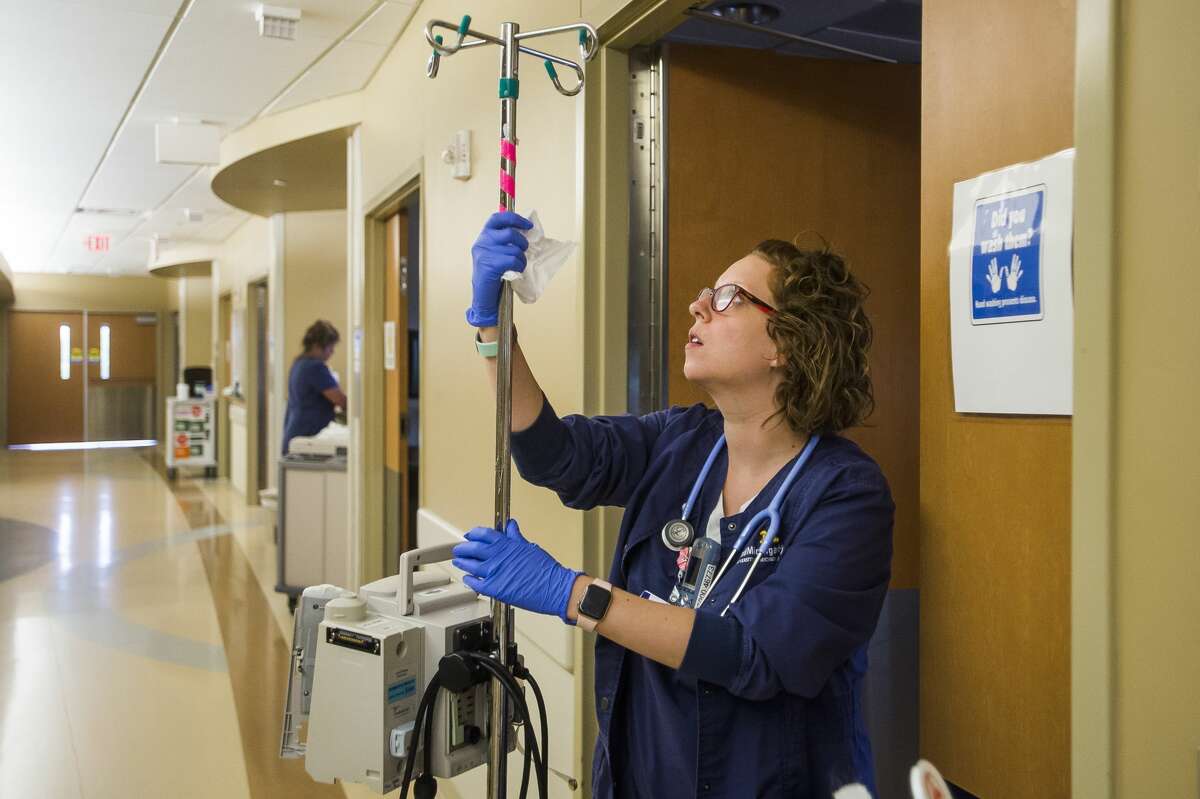 Heather Orvis, a registered nurse at MidMichigan Medical Center, works during her shift Thursday, July 25, 2019 at the Midland hospital. (Katy Kildee/kkildee@mdn.net)