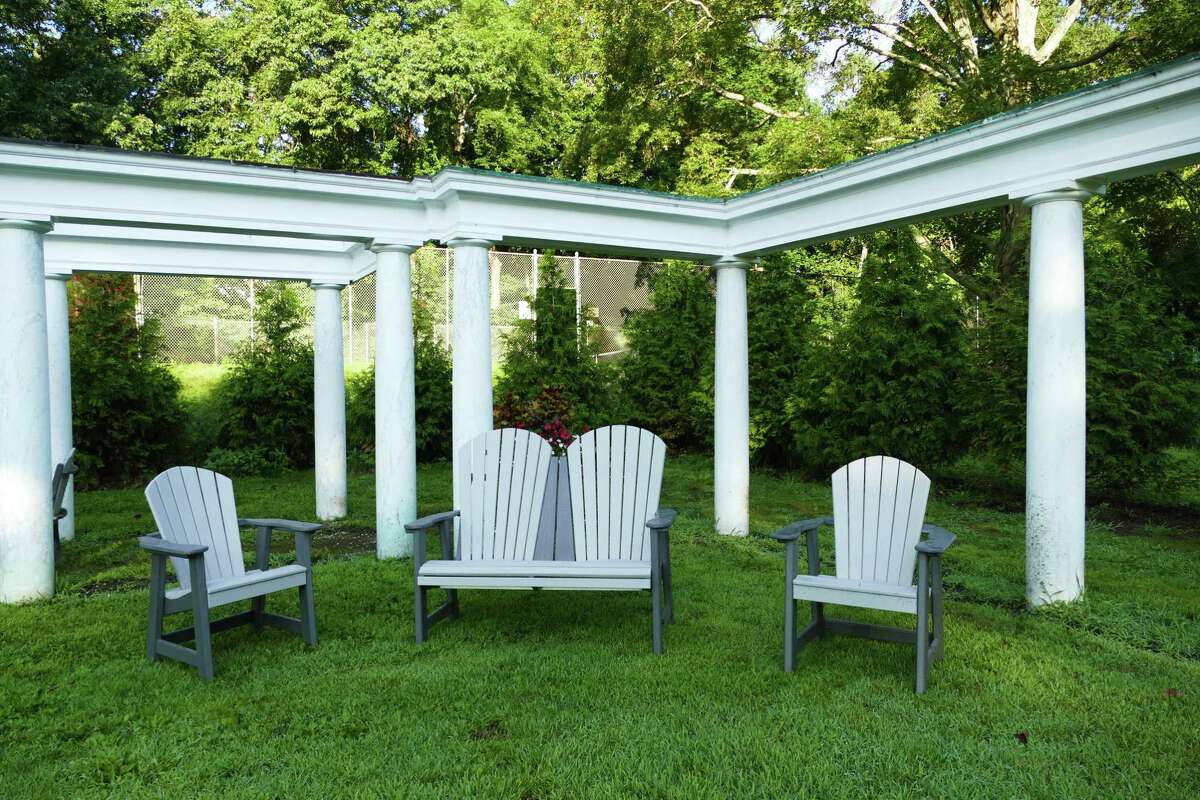 The colonnade at Mead Park in New Canaan has new furniture and will be getting a flagstone-like flooring to invite people to socialize after a tennis game.