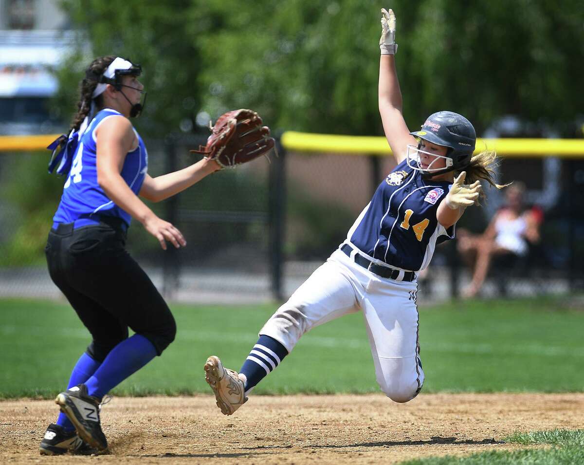 Milford’s Mya Dawid slides safely into second base on her way to scoring a tying run in the 4th inning of the championship game of the 2019 Little League Softball Eastern Regional Tournament in Bristol on ThursdaySouth Williamsport, PA defeated Milford, 3-2.