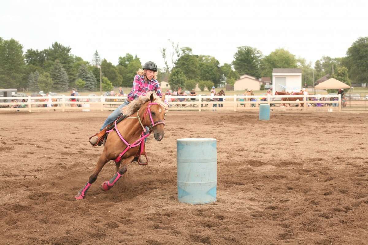 SHOWMANSHIP: Around 100 riders competed in the horse show at the Mecosta County Agricultural Free Fair on Thursday and Friday. Riders competed to complete each course with the quickest time. (Pioneer photos/Jonathan Eppley)