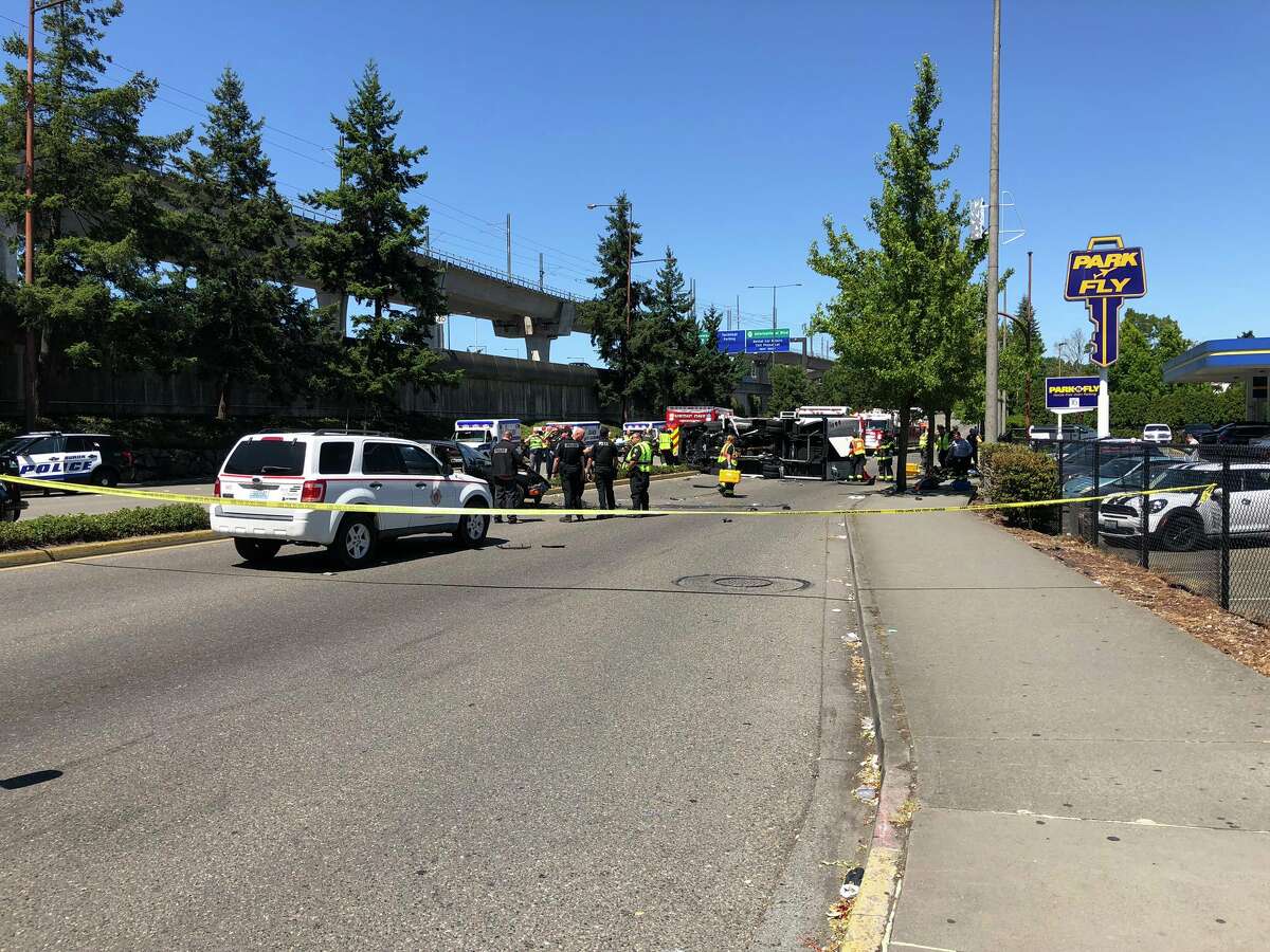 Authorities say one person is dead and seven others were injured in a crash involving a hotel shuttle bus near the Seattle-Tacoma International Airport.