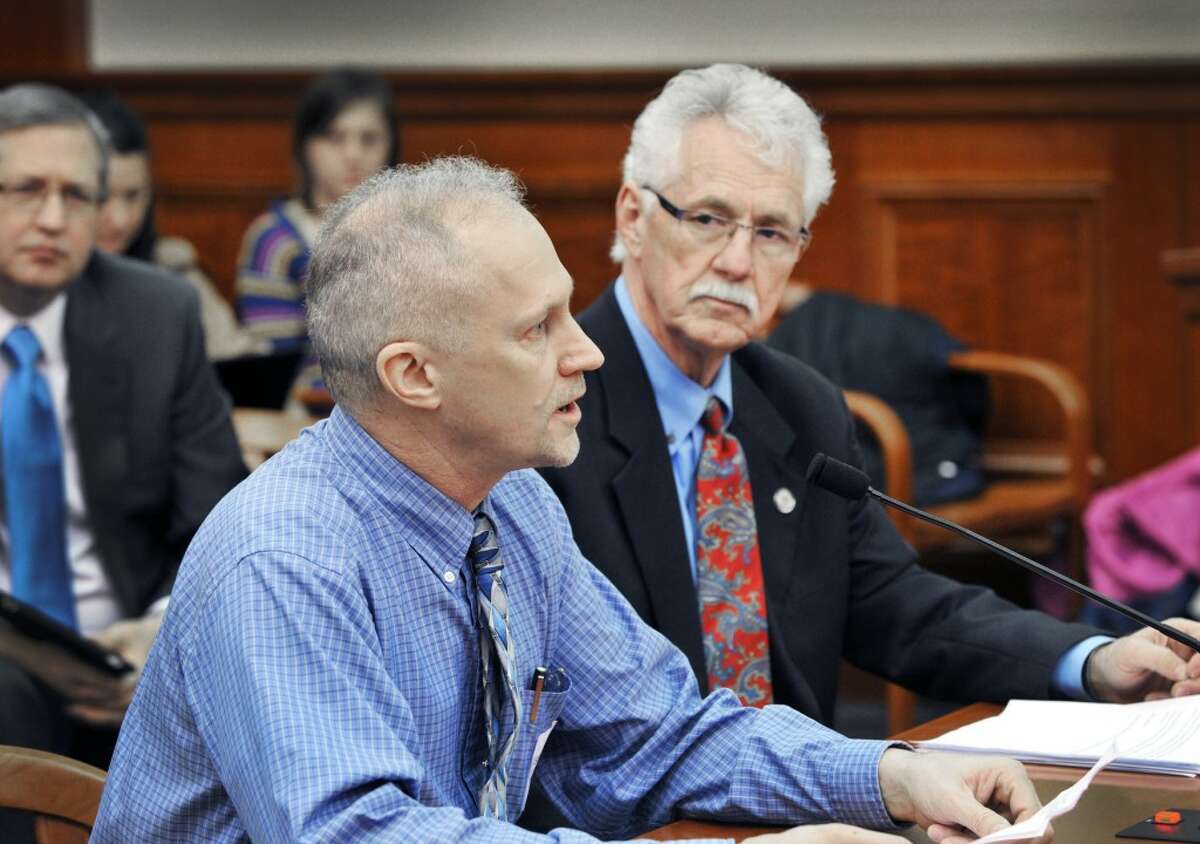 FOREST MANAGEMENT: Sen. Darwin Booher, R-Evart, listens as Rick Lucas, the conservation district forester with Osceola, Lake and Mecosta counties, tells the House Natural Resources Committee on Tuesday about the need to approve Booher’s legislation to help landowners improve the management of their forestlands. (courtesy photo)