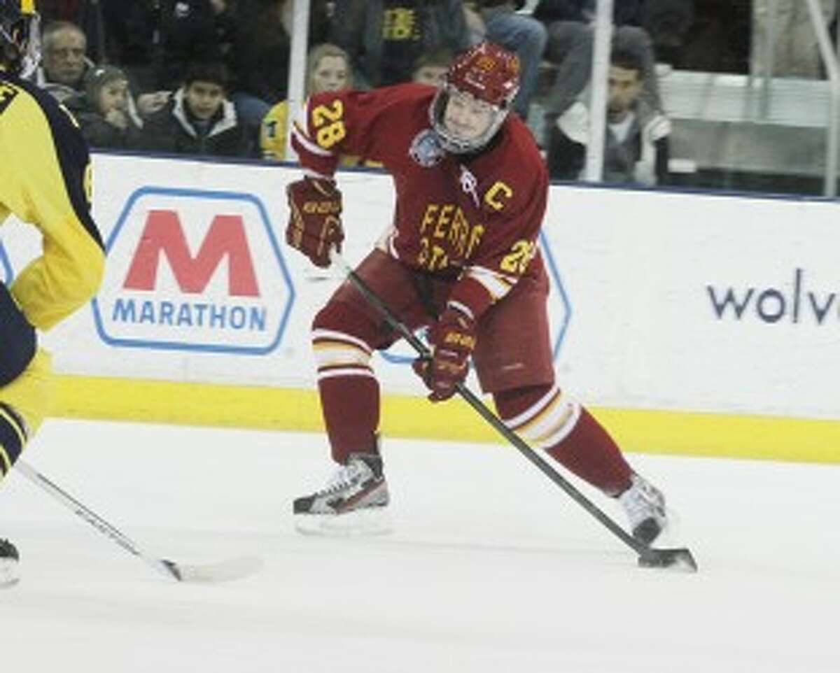 LET IT RIP: Ferris State's Kyle Bonis (28) takes a shot on net against Michigan. Bonis was honorable mention all CCHA this season. (Pioneer file photo)