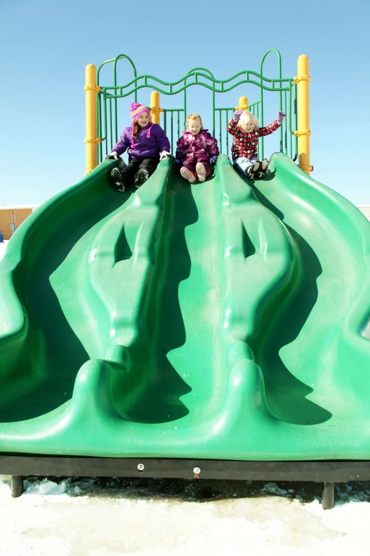 SOCIAL SKILLS: MSES students prepare to go down the slide. Recess offers students a chance to develop their social skills as they play together.