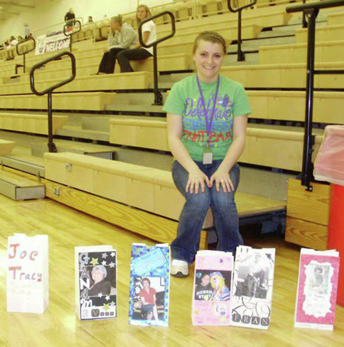 RELAY ENTHUSIAST: Ferris State University student Whitney Rivest, president of Ferris’ Colleges Against Cancer chapter, poses with luminaries. Rivest organized this year’s Relay for Life event, which will take place on Friday and Saturday. She has participated in relays for nine years. (Courtesy photo)