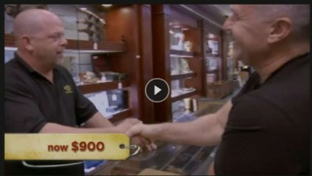 LET’S MAKE A DEAL: A screen shot of the reality TV show “Pawn Stars” taken from history.com shows former Big Rapids High School teacher and football coach Randy Park (right) making a deal with the star of the show, Rick Harrison (left). The show features the daily activities of a pawn shop in Las Vegas. Park sold a book autographed by Dwight D. Eisenhower for $900. (Courtesy photo)