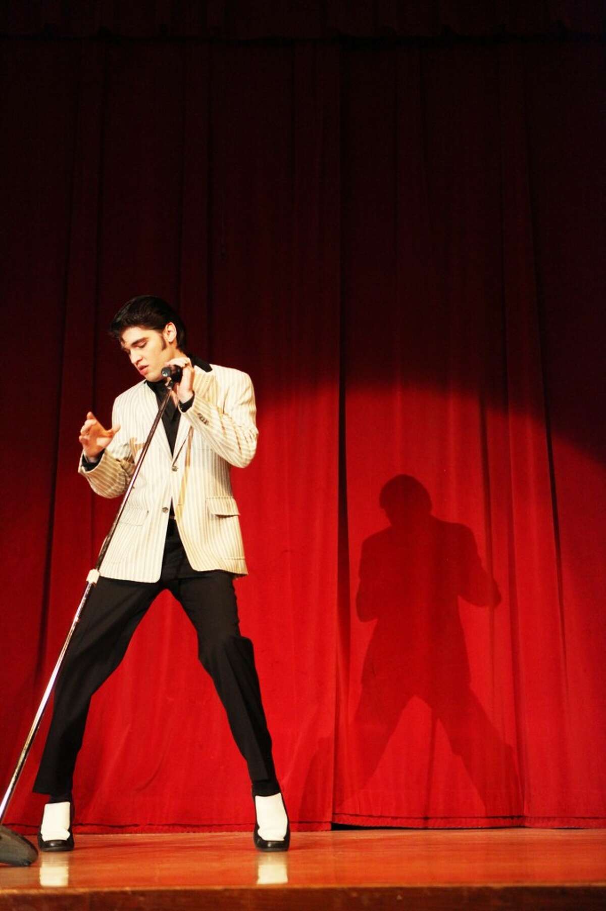Elvis impersonator Jake Slater performs on Saturday at a fundraiser for Mecosta County CARES, a nonprofit organization that educates people on the importance of spaying and neutering their pets. Proceeds from Saturday's concert will go toward sterilizing animals adopted from the Animal Rescue Coalition in Big Rapids. (Pioneer photo/Whitney Gronski-Buffa)