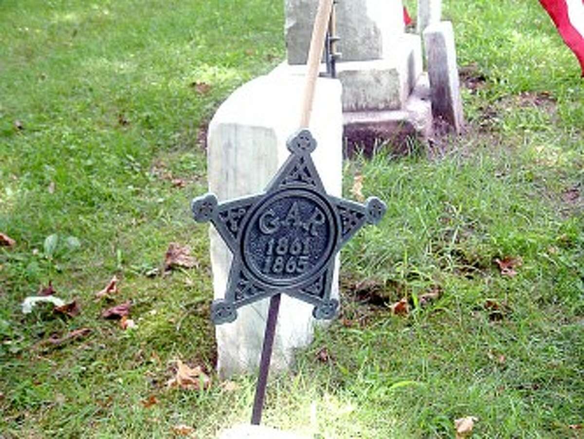 CEMETERY THEFT: About 30 brass flag holders marking the graves of Civil War veterans recently were stolen from Highland View Cemetery. (Courtesy photo)