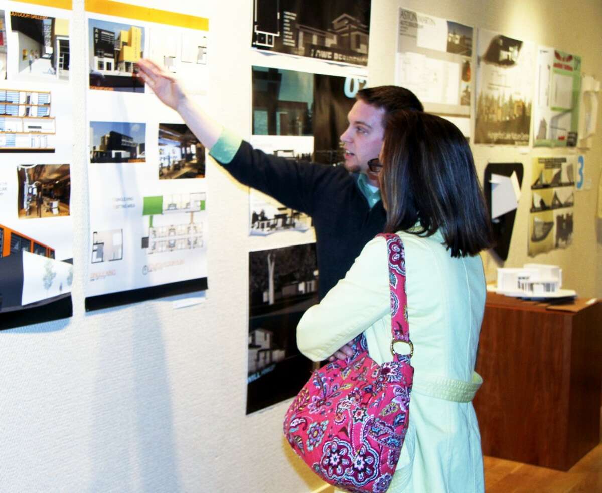 ART AND ARCHITECTURE: A Ferris State University architecture student explains one of the projects on display at the Rankin Art Gallery this month. The “Art of Architecture” exhibit showcases the creativity of architecture students in their design projects. (Pioneer photos/Lauren Fitch)