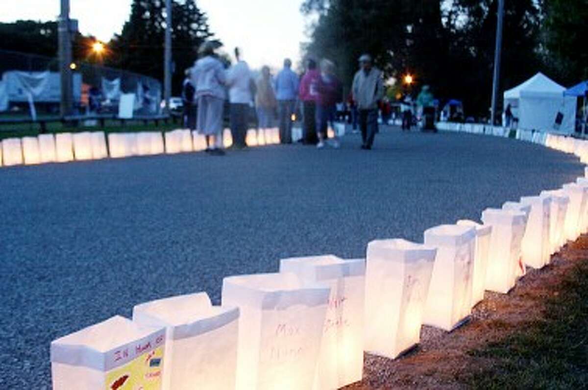 LIGHTING THE WAY: More than 1,300 luminaries were lit at dusk during the 2011 Relay for Life. Participants could make luminaries in memory of someone who had died of cancer or in honor of someone who had survived cancer or is still dealing with it.