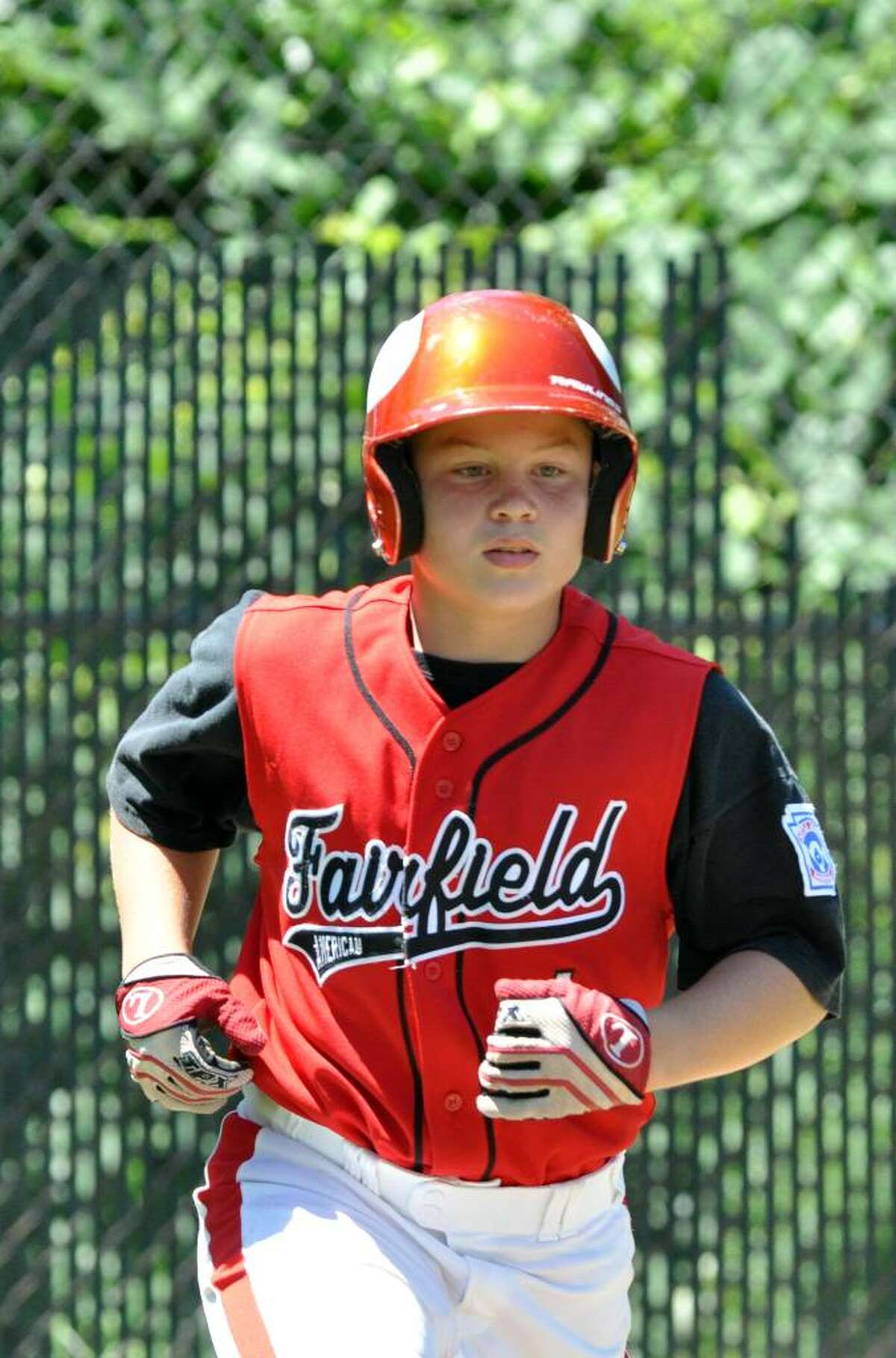 Fairfield American's Jack Quinn runs to first base during the all star little league game against Madison at Blackham School field in Bridgeport on Saturday, July 31, 2010.