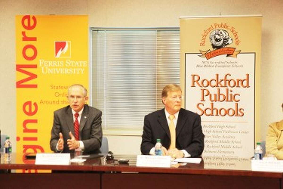 Ferris State University President David Eisler (left) explains part of the new concurrent enrollment agreement between Ferris and Rockford schools. He is joined by Rockford superintendent Michael Shibler (right).