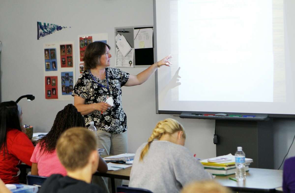 INCREASED ACCOUNTABILITY: Crossroads Charter Academy teacher Alice Routley leads her students through a math review lesson. Michigan law now requires all teachers be evaluated every year, with higher stakes being attached to those evaluations. (Pioneer photos/Lauren Fitch)