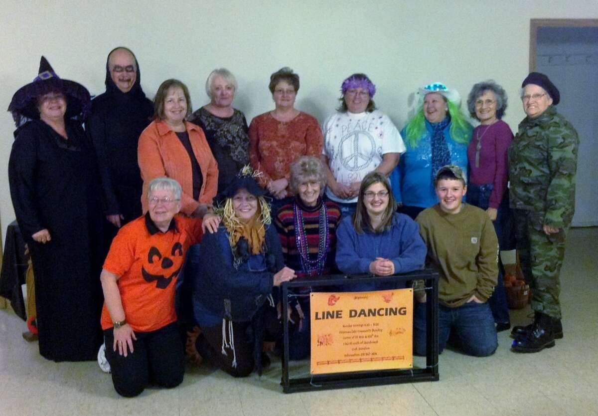 MONSTER MASH: Attendees at the Chippewa Lake line dancers’ Halloween party on Monday gather for a photo. The group dances every Monday; everyone is welcome to join. (Courtesy photo)