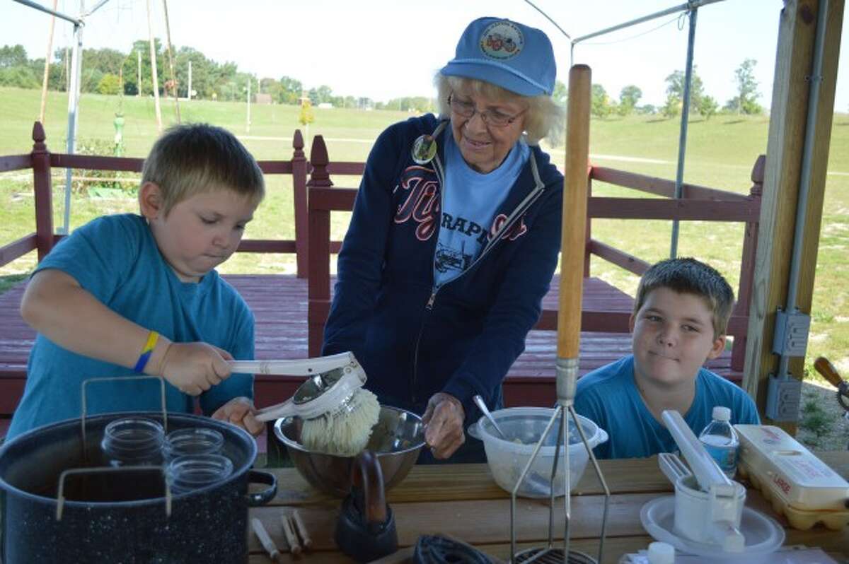 Evart Middle School students use antique farming tools