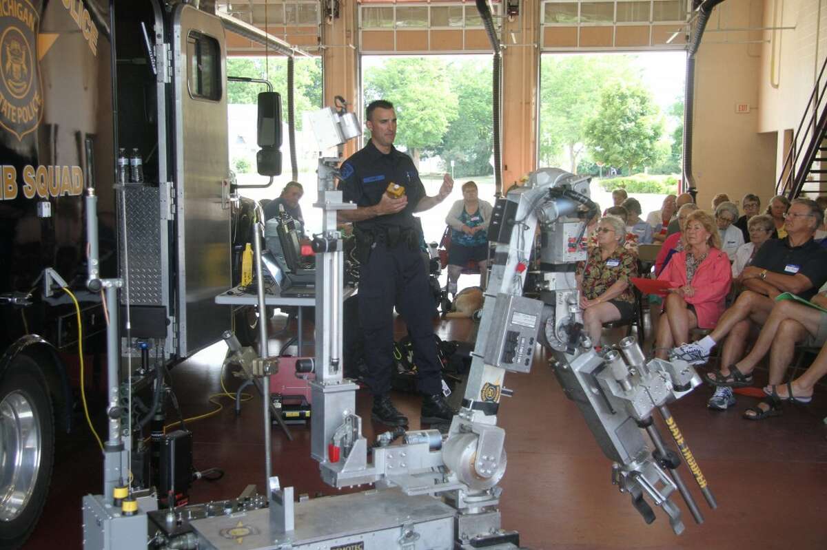 ROBOCOP: Det. Sgt. Joseph Roney of the Michigan State Police Bomb Squad gives a presentation to Camp 9-1-1 attendees about how his team dismantles bombs using robots. (Pioneer photos/Whitney Gronski-Buffa)