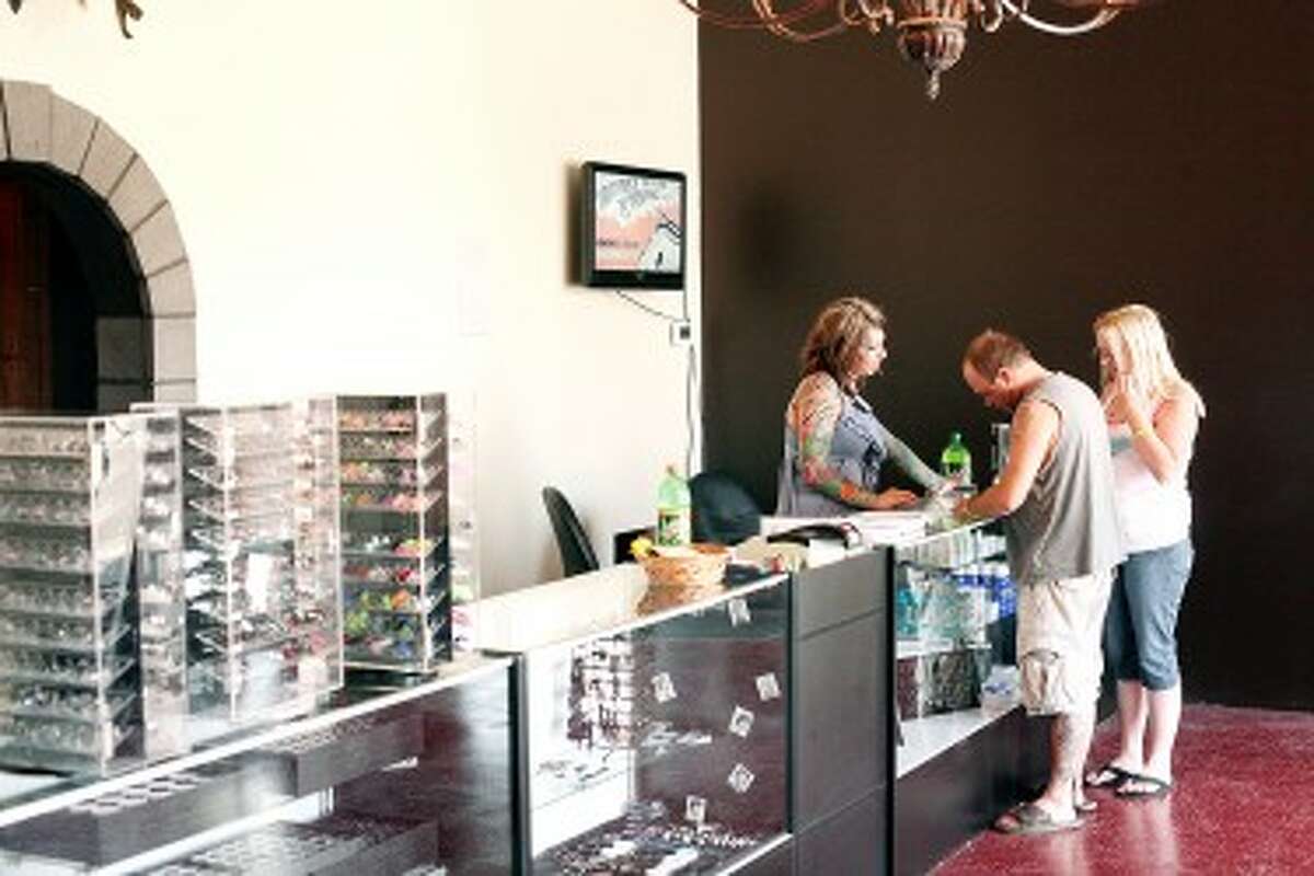 RENOVATION: Sonya Grenell and Jesse Cocking, owners of Lighttouch Tattoo, recently relocated their business in downtown Big Rapids. They spent the past seven months renovating the space, which includes a retail area and a service area with three tattoo stations and a private piercing room.