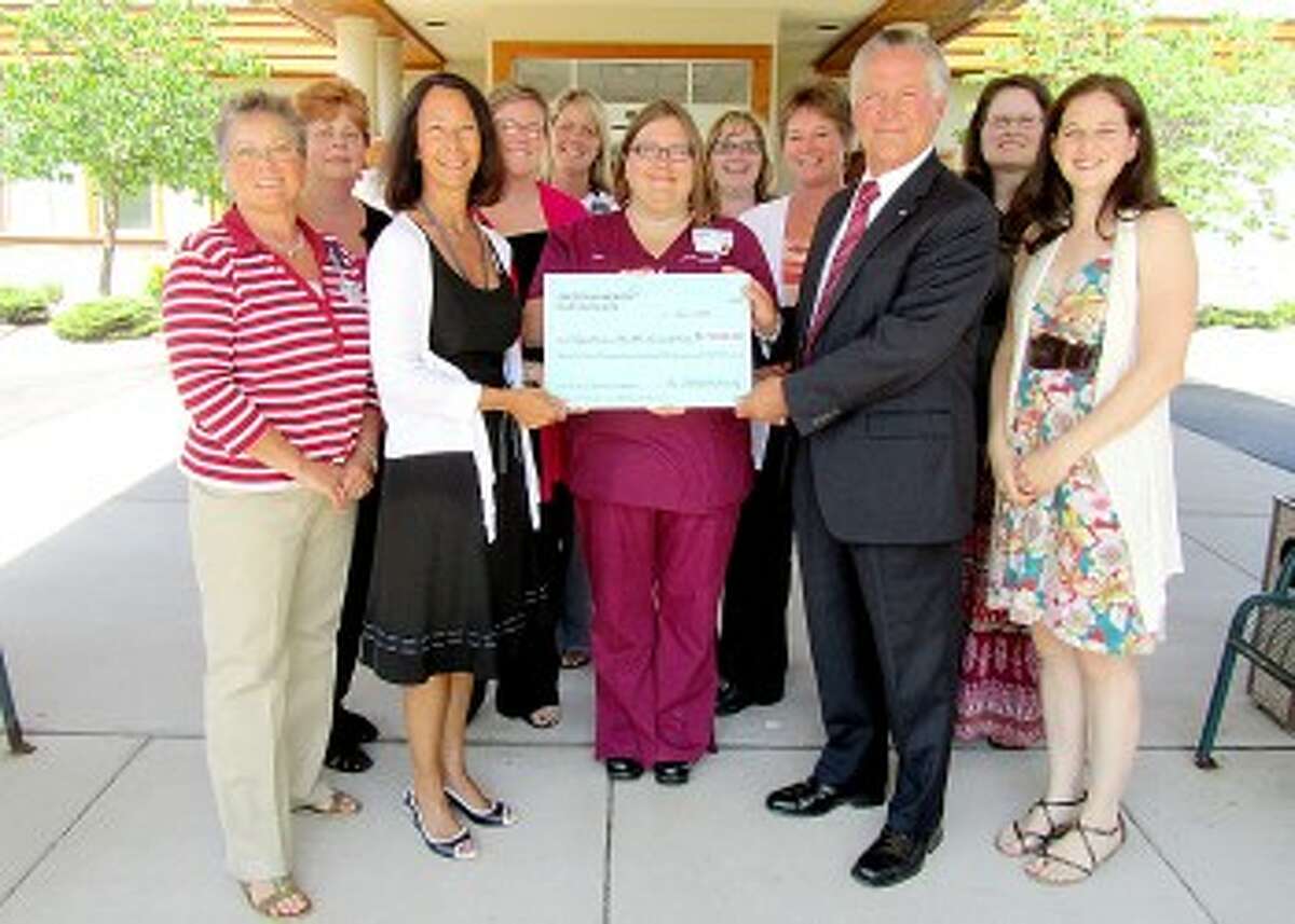 GENEROUS GIFT: A generous donation from Spectrum Health Reed City Hospital employees aides the “Bringing Hope Closer to Home” capital campaign for the Susan P. Wheatlake Regional Cancer Center. Pictured (from left to right) are Irene Balowski, Lori Jeffrey, Sheri Thompson, Mindy Fewless, Jenna Johnson, Angel Redinger, Brenda Lambrix, Kim Nix, Carl Linebaugh, Christie Carlson and Char Keysor. (Courtesy photo)