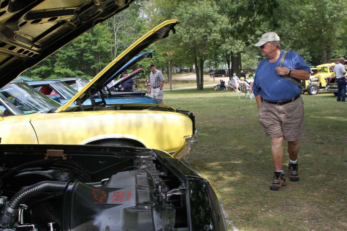 CHECKING IT OUT: This year, the Canadian Lakes Cruisers Club car show featured about 85 vehicles. (Pioneer Photos/Eric Dresden)