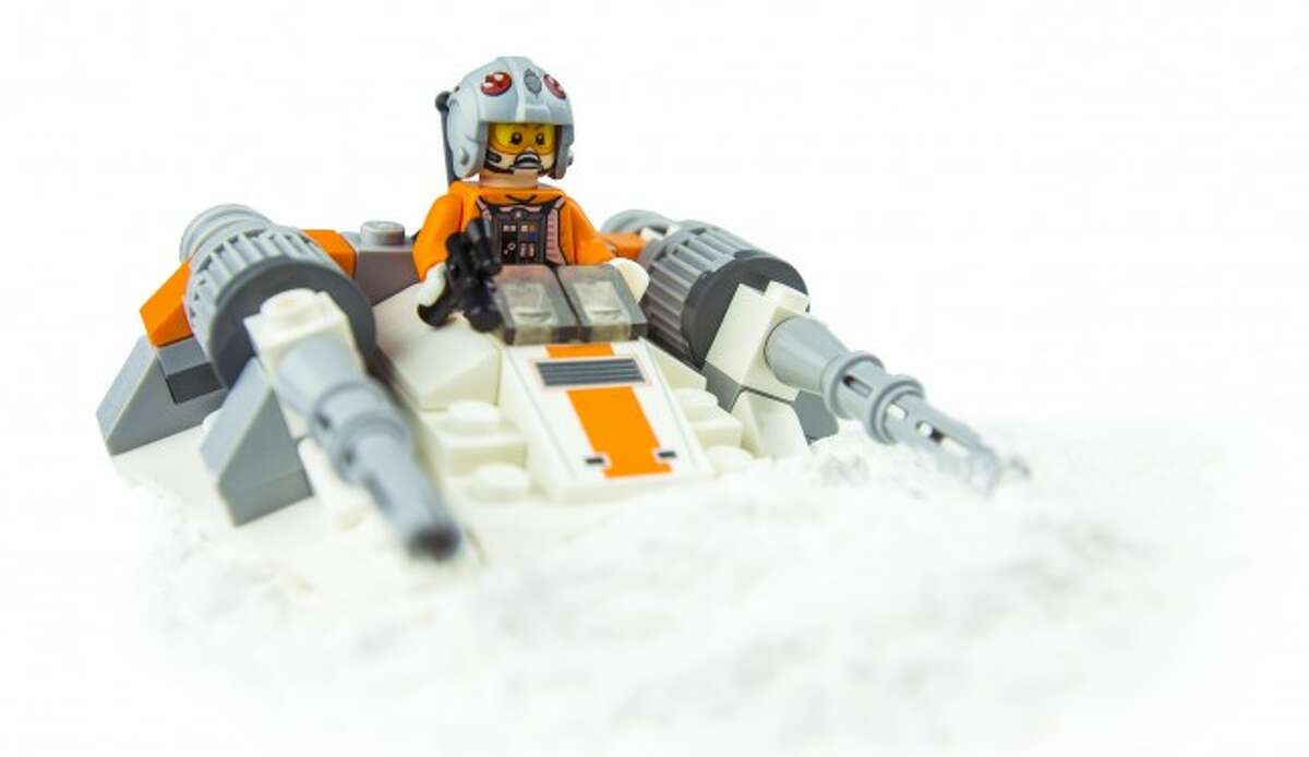 CRASH LANDING: While I did not shoot the image above with the Canon 65mm macro, this is technically a macro-type image. I used my Canon 16-35mm f/2.8 L USM II at its closest focus distance to produce an image that is larger than the actual toy. I used powdered sugar for snow. It was ... a mess.