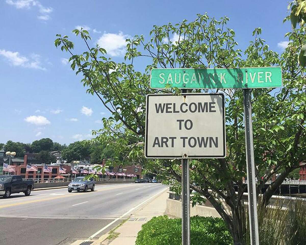 A sign reading 'Welcome to Art Town" near the Post Road bridge in downtown Westport.
