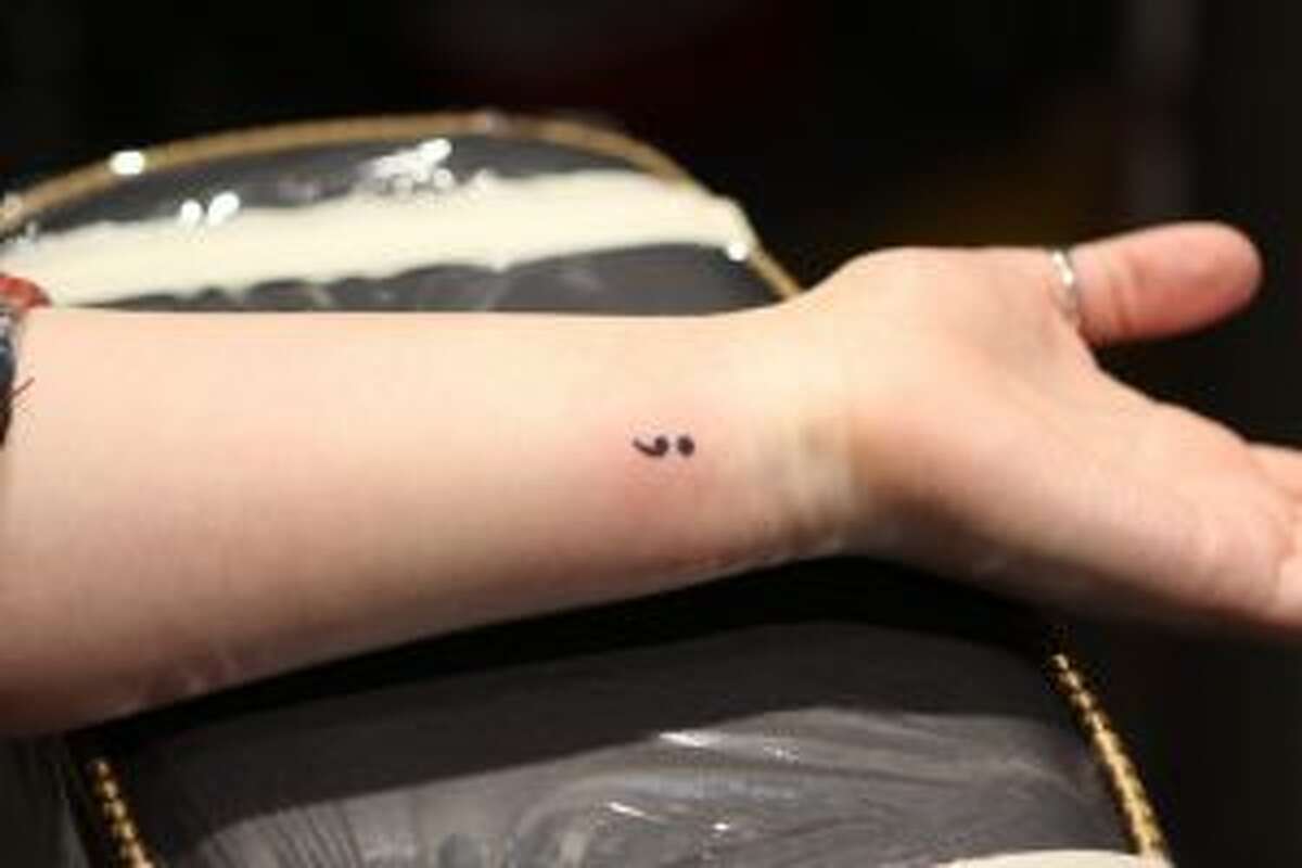 Semicolon tattoos, piercings event helps raise funds for suicide survivor  program