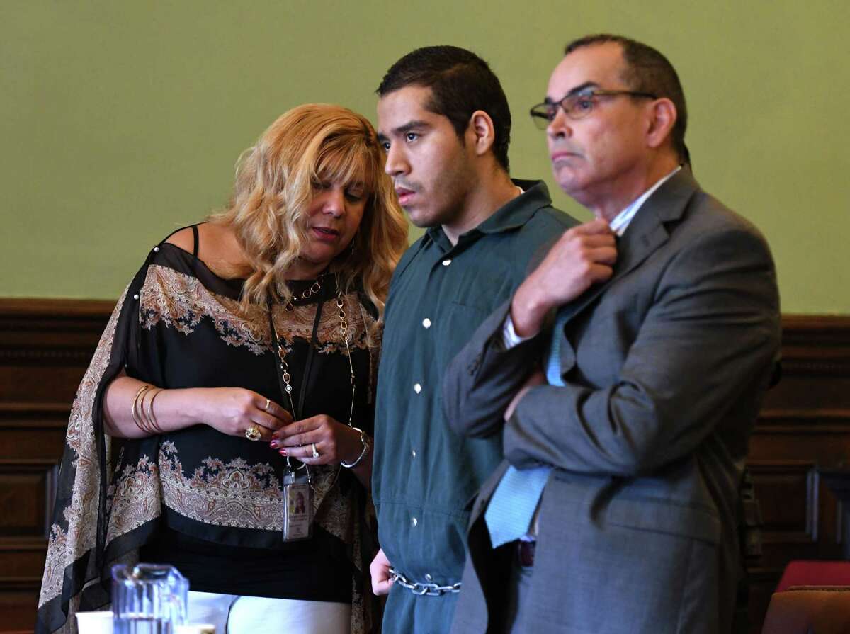 Luis Monge Guevara, center, is sentenced to prison for his murder conviction in North Central Troy on Friday, July 26, 2019, at the Rensselaer County Courthouse in Troy, N.Y. He appeared before Judge Andrew Ceresia with his attorney, Jay Hernandez III, right, and a court appointed interpreter, left. (Will Waldron/Times Union)