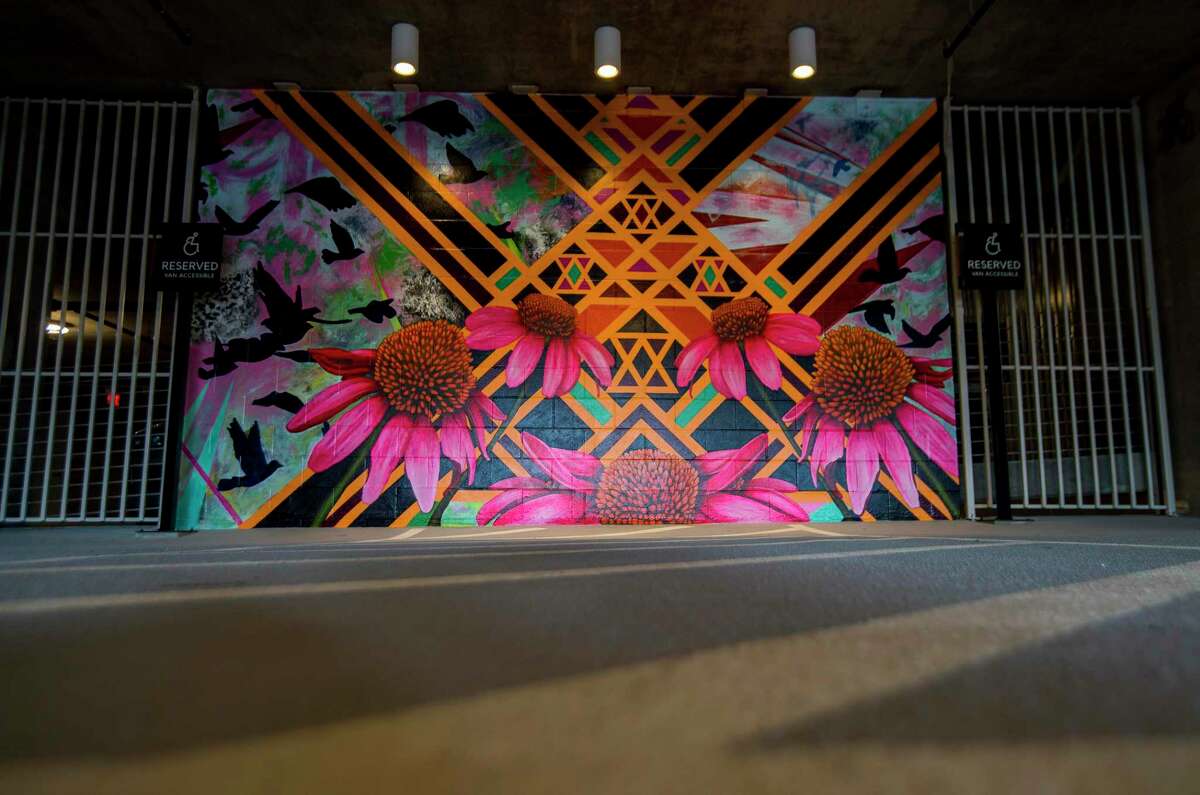A trio of murals by Patricia Barrera decorate walls at the entrance to the parking garage at the new Drewery Place luxury high-rise in midtown Houston, Tuesday, July 2, 2019.