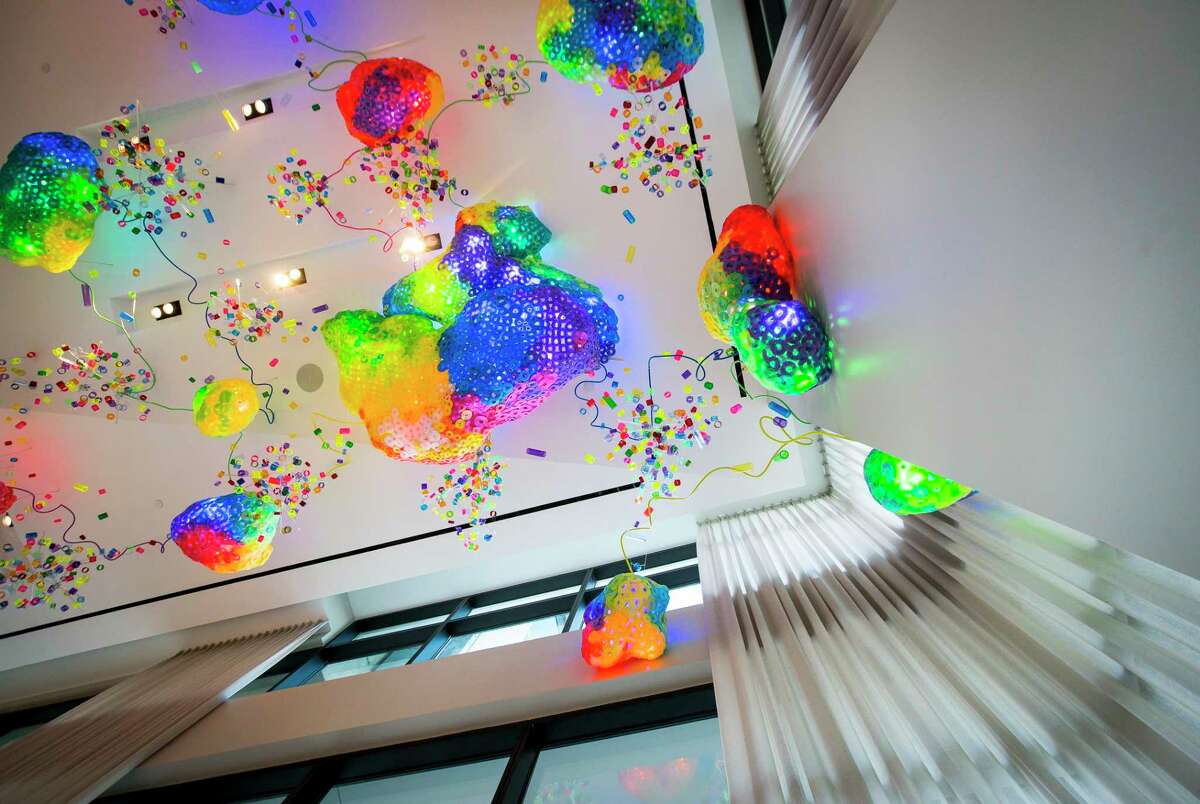 Adela Andea's "The Great Barrier Reef" hangs from the lobby ceiling at the new Drewery Place luxury high-rise in midtown Houston, Tuesday, July 2, 2019.
