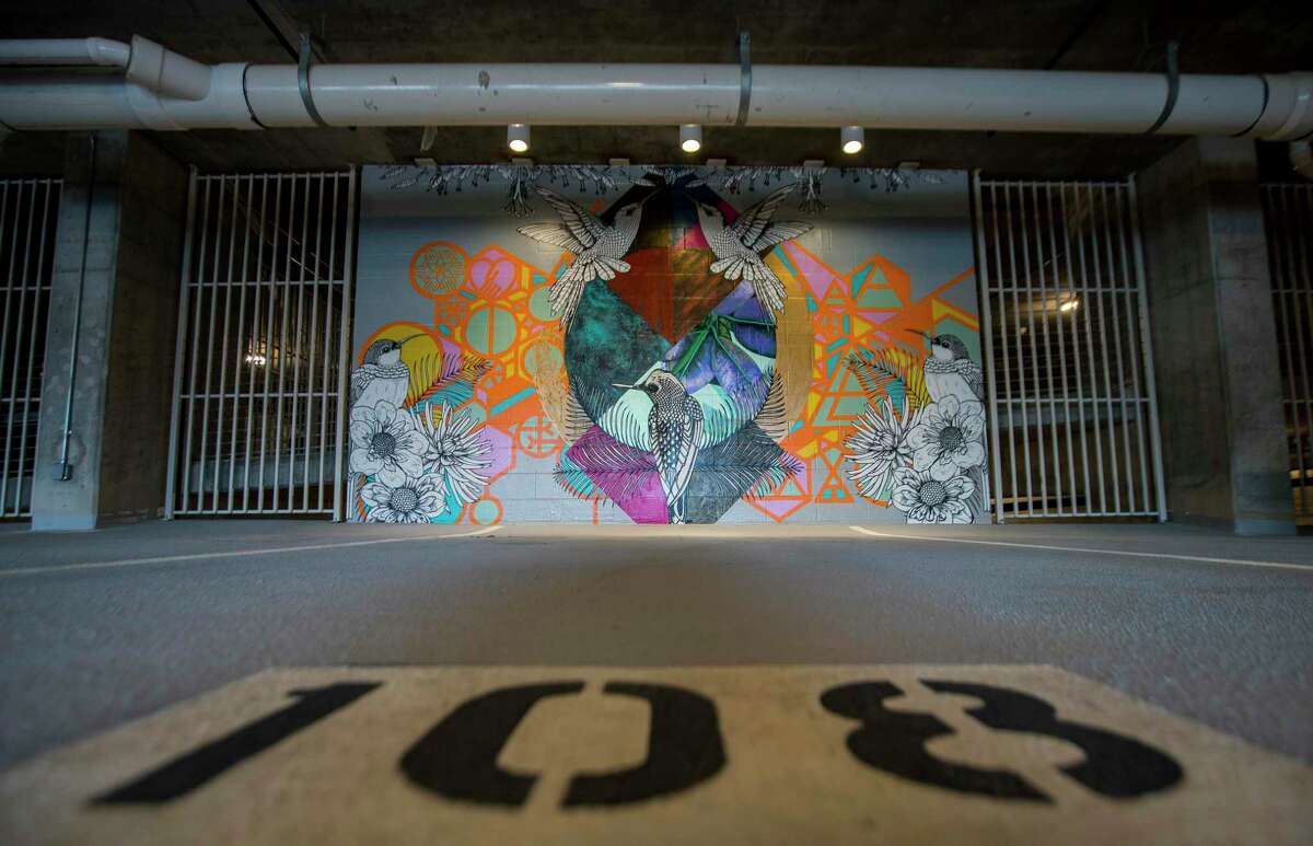 A trio of murals by Patricia Barrera decorate walls at the entrance to the parking garage at the new Drewery Place luxury high-rise in midtown Houston, Tuesday, July 2, 2019.