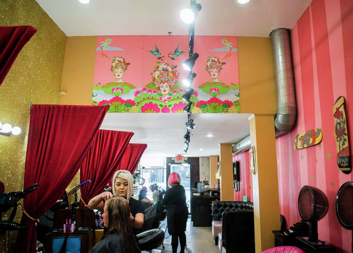 Art hangs everywhere in Kat's Meow Saloon on Winbern Street near the Mid Main Lofts in Houston, Thursday, July 25, 2019. Lane and Bob Schultz have worked to fill much of the common areas along Main Street in that section of midtown with public art form murals to window displays in currently vacant buildings.