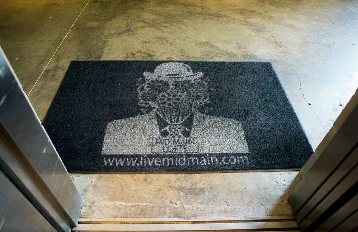Artist Charlie Hardwick created the piece that is now used as part of the logo for the Mid Main Lofts in Houston, Thursday, July 25, 2019. Lane and Bob Schultz have worked to fill much of the common areas along Main Street in that section of midtown with public art form murals to window displays in currently vacant buildings.