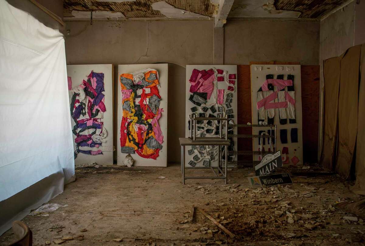 Art is everywhere along a stretch of Main Street across from the Mid Main Lofts in midtown, including in a vacant building, Thursday, July 25, 2019. Lane and Bob Schultz have worked to fill much of the common areas along Main Street in that section of midtown with public art form murals to window displays in currently vacant buildings.