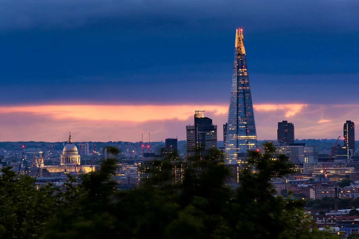 St. Paul's Cathedral, left and The Shard stand out in relief against the darkening London skyline on May 20, 2017.
