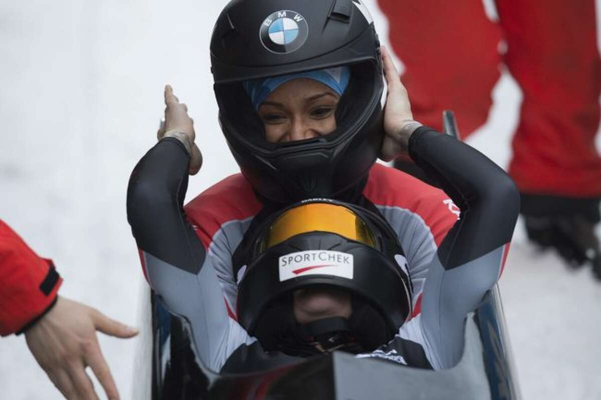 Canada’s winners Kaillie Humphries, front, and Phylicia George celebrate after the women’s bob competition at the Bob World Cup in Altenberg, Germany, Saturday, Jan. 6, 2018. (Sebastian Kahnert/dpa via AP)