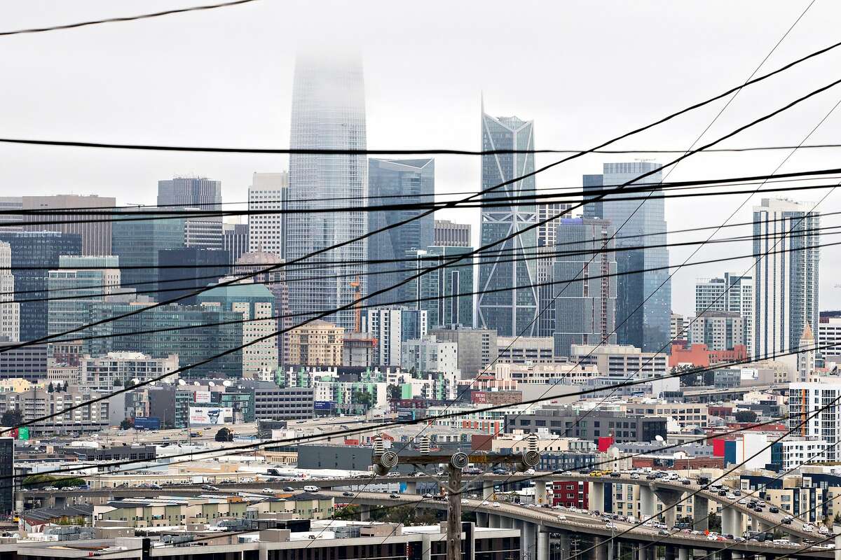 PG& power lines cross over the San Francisco skyline, as seen from 20th and Carolina streets. San Francisco officials recently sent a letter to PG& offering to buy the company's electrical infrastructure in the city.