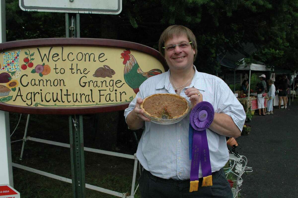 Dave Barrett shows off the sweet potato pecan pie with which he won first place at the Cannon Grange Agricultural Fair in 2012.