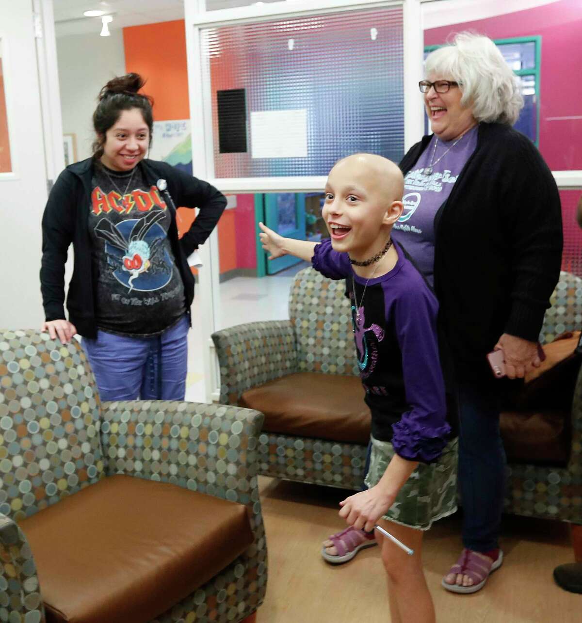 Kaylee Tolleson introduces Angela Menchaca, her patient care advocate, to her friends and family at Texas Children's Hospital as friends and family gathered to celebrate.