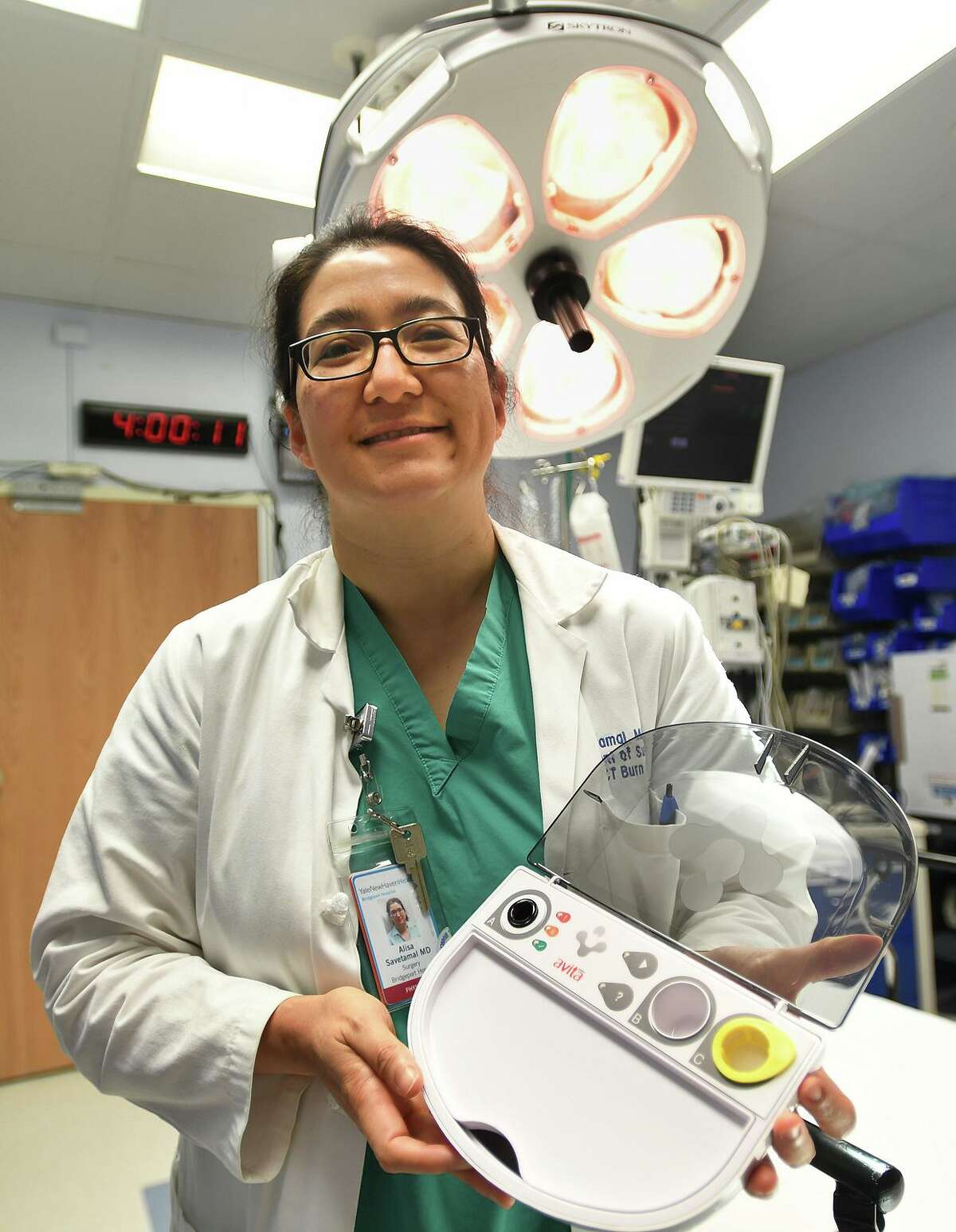 Dr. Alisa Savetamal, medical director of the Connecticut Burn Center, holds a RECELL kit, a system that creates spray on skin from a patient's own cells for use in burn treatment, at Bridgeport Hospital in Bridgeport, Conn. on Wednesday, July 24, 2019.