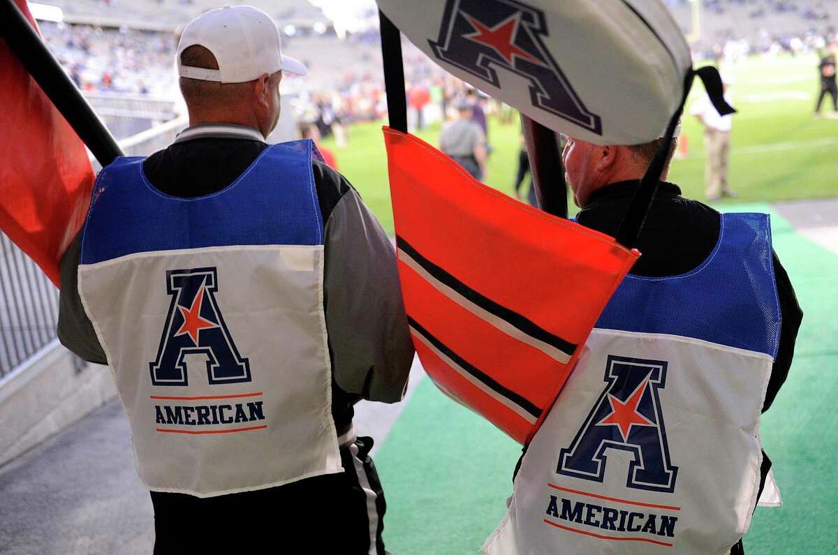 EAST HARTFORD, CT - SEPTEMBER 14: Members of the chain gang walk onto the field wearing the logo of the American Athletic Conference before the game between the Connecticut Huskies and the Maryland Terrapins at Rentschler Field on September 14, 2013 in East Hartford, Connecticut. (Photo by G Fiume/Maryland Terrapins/Getty Images)
