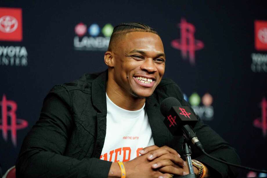 Image result for Russell Westbrook all smiles during introduction with Rockets