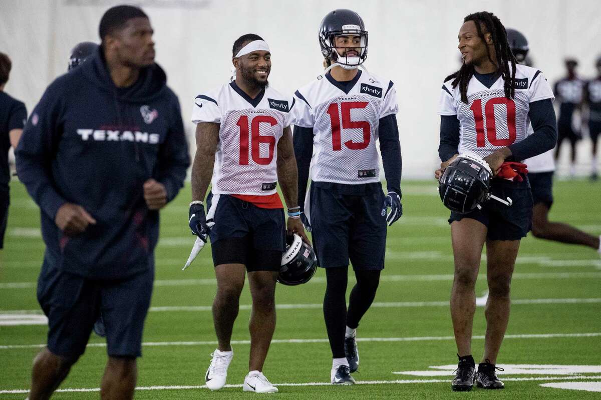 PHOTOS: Texans vs. Jaguars  Andre Johnson, far left, jogs up the field past Houston Texans wide receivers Keke Coutee (16), Will Fuller (15) and DeAndre Hopkins (10) walk up the field together during training camp at the Methodist Training Center on Friday, July 26, 2019, in Houston. >>>See more photos from the Texans' first win of the season ... 