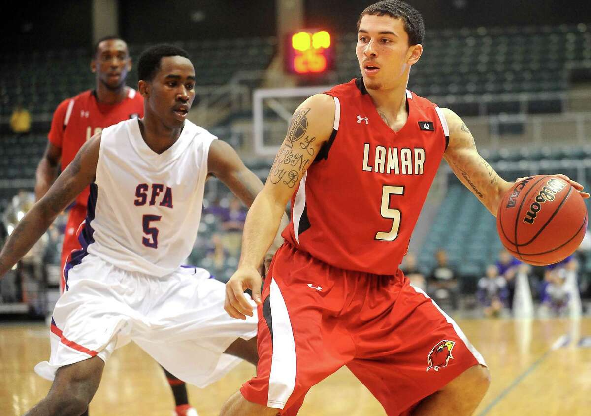 Lamar's Mike James tries to get around SFA's Antonio Bostic at the Merrell Center in Katy, Thursday, March 8, 2012. Tammy McKinley/The Enterprise