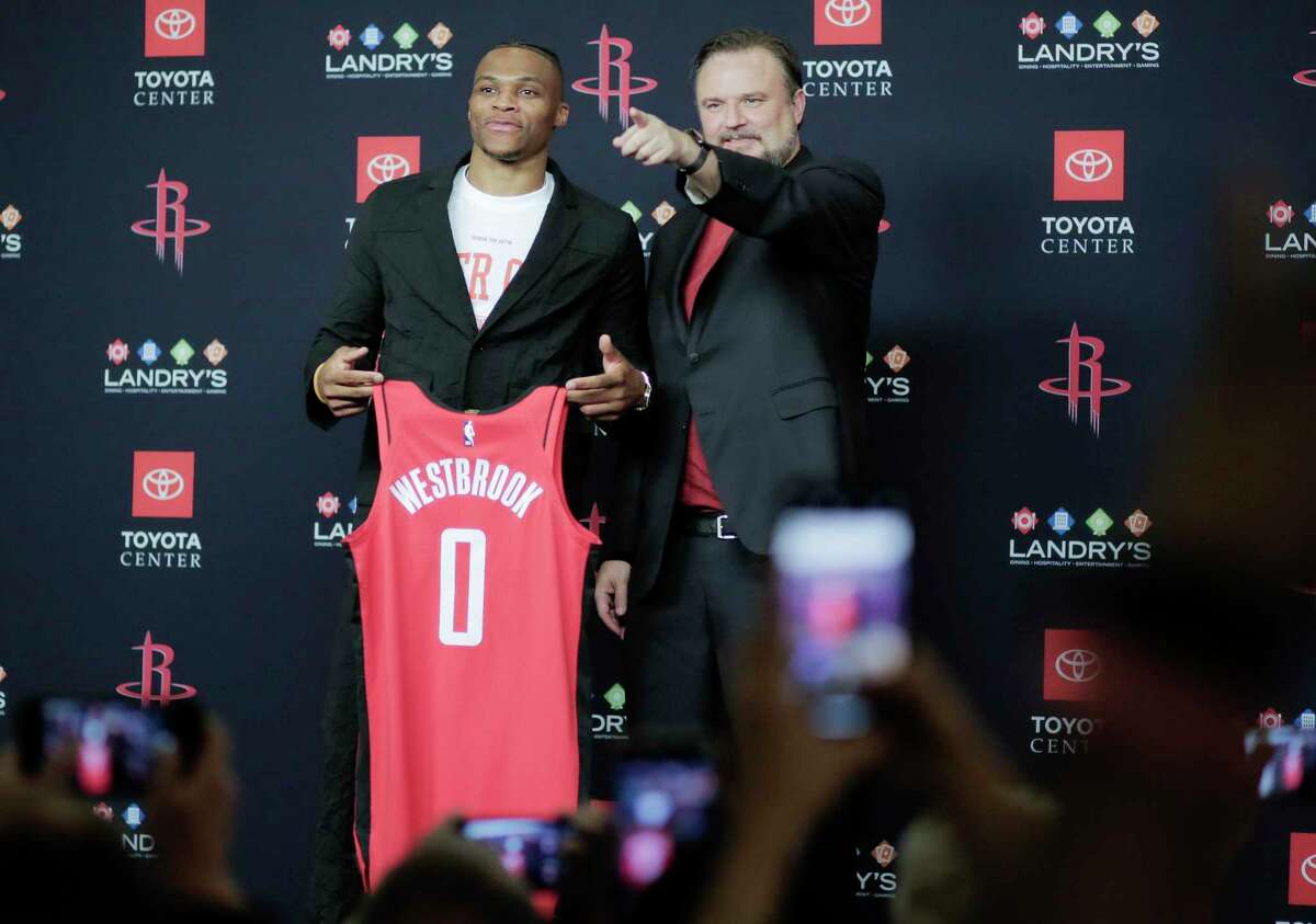 Russell Westbrook, left, and Rockets general manager Daryl Morey bring Toyota Center to offseason life Friday to welcome the star guard to Houston.