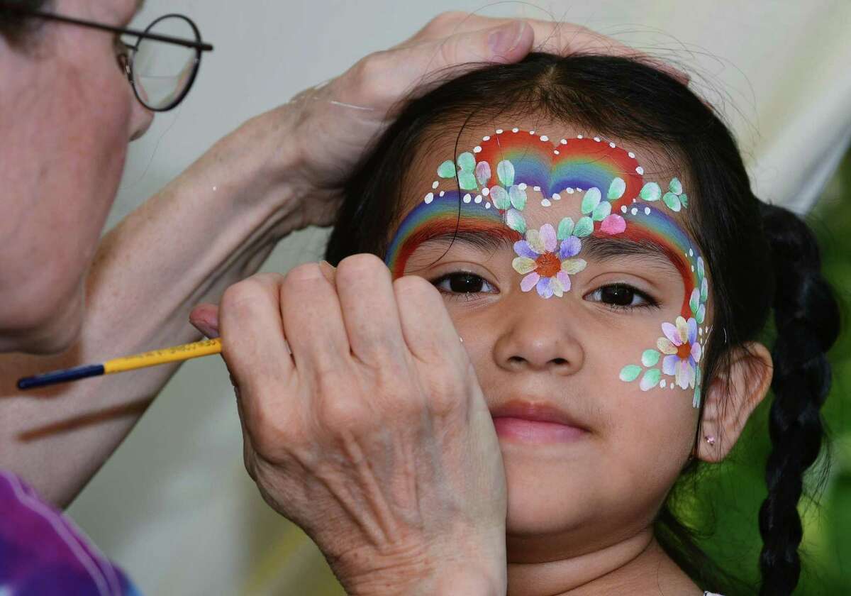 Sonia Mendieta, 3, gets her face painted at the 90th year of the St. Ann's Feast Friday, July 26, 2019, at the St. Ann's Club on Hendricks Avenue in Norwalk. Conn. The Club was established 105 years ago to celebrate italian hertiage. The festival raises close to $50,000 very year for local charities and attracts thousands of visitors.