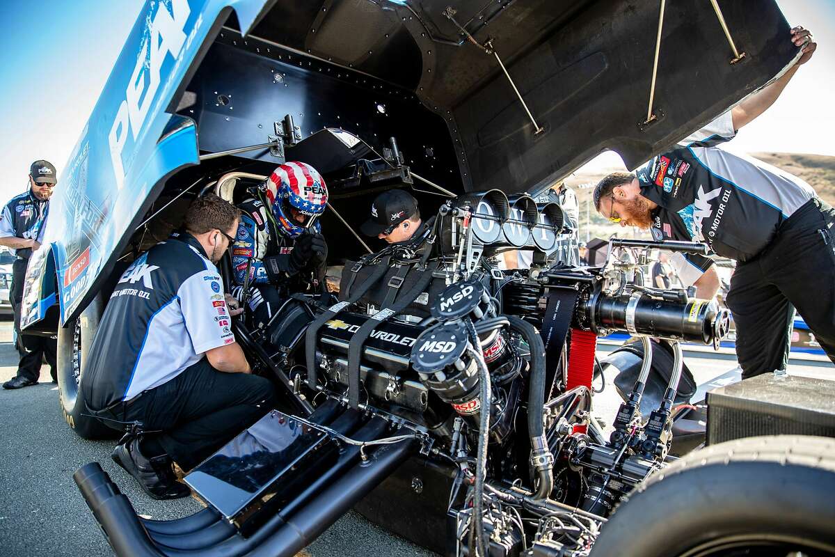 John Force gets inside his 2019 Chevrolet Camaro SS NHRA Funny Car for the first round of eliminations during the Sonoma Nationals National Hot Rod Association (NHRA) on Friday, July 26, 2019, in Sonoma, Calif.