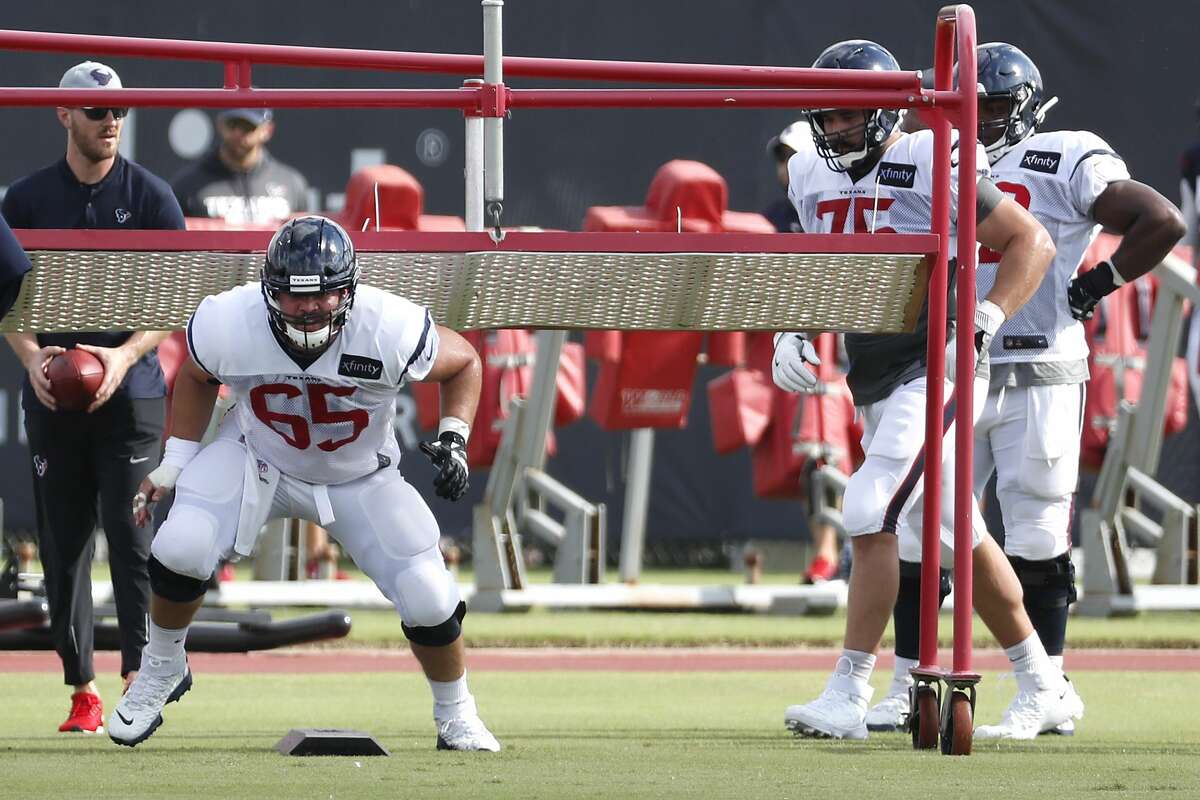 Houston Texans offensive guard Greg Mancz (65) burst out of his stance during a drill during training camp at the Methodist Training Center on Saturday, July 27, 2019, in Houston.